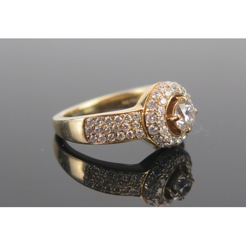 133 - An 18ct Gold and Diamond Ring, 4.84mm principal round cut stone, stamped 750, size M, 6.54g