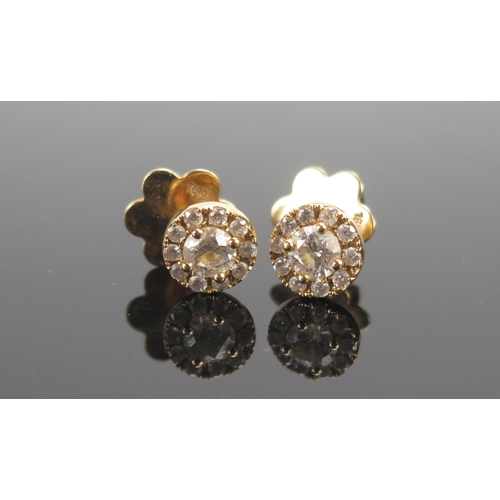 136 - A Pair of 18ct Gold and Diamond Cluster Stud Earrings, c. 4.43mm brilliant round cut principal stone... 