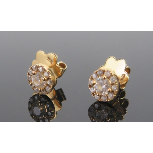 136 - A Pair of 18ct Gold and Diamond Cluster Stud Earrings, c. 4.43mm brilliant round cut principal stone... 