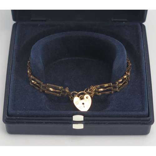 187 - A 9ct Gold Gate Link Bracelet with 'padlock' clasp, 3.66g, H. Samuel boxed