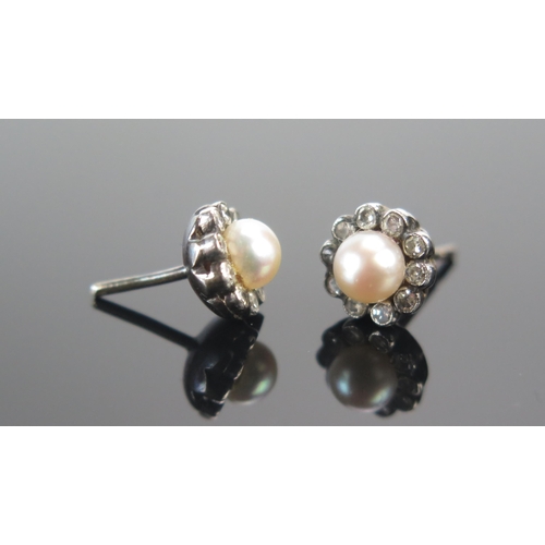 23 - A Pair of Old Cut Diamond and Pearl or Cultured Pearl Stud Earrings in a precious white metal mount ... 