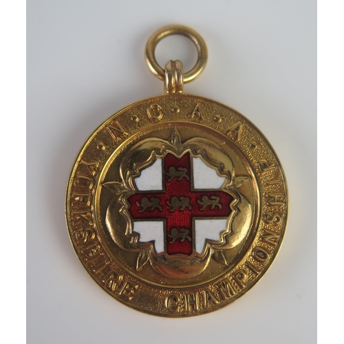 420 - A 9ct Gold and Enamel Yorkshire N.C.A.A. Championship 1934 440yds Winners Fob Medallion, 18g