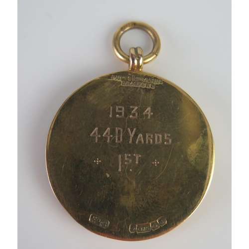 420 - A 9ct Gold and Enamel Yorkshire N.C.A.A. Championship 1934 440yds Winners Fob Medallion, 18g