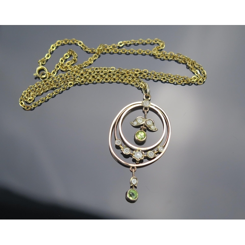 45 - A 9ct Gold, Peridot and Seed Pearl Pendant, 46mm drop, stamped 9CT, 2.21g and one a gold plated chai... 