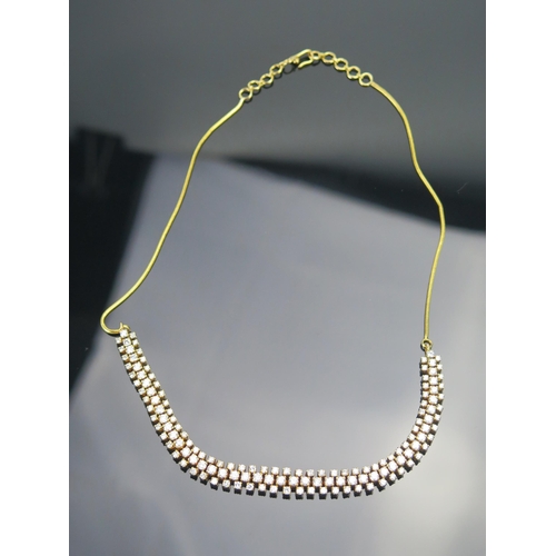 5 - A Diamond and Precious Yellow Metal Necklace set with 47 c. 2.65mm and 92 c. 2mm brilliant round cut... 