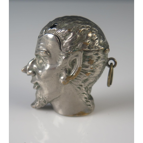 576 - A silver plated novelty vesta case modelled as the devil's head, with push-nose operated hinged lid,... 