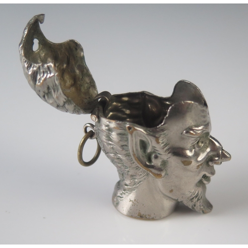 576 - A silver plated novelty vesta case modelled as the devil's head, with push-nose operated hinged lid,... 