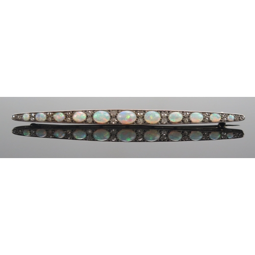 58 - An Opal and Old Cut Diamond Bar Brooch in a precious white metal setting, 71.9mm, early 20th century... 