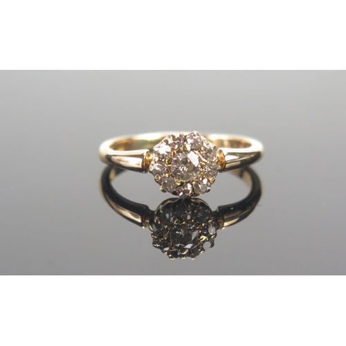 63 - An Old Cut Diamond Cluster Ring in a high carat precious yellow metal setting, size P.5, 8.14mm head... 