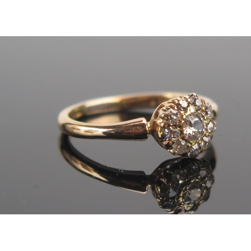 63 - An Old Cut Diamond Cluster Ring in a high carat precious yellow metal setting, size P.5, 8.14mm head... 