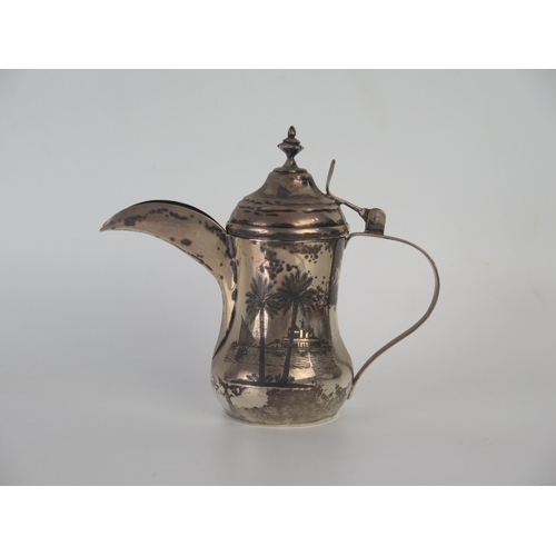 649 - An Egyptian silver and niello decorated coffee pot of traditional design, 14cm high, 171gms, 5.50ozs