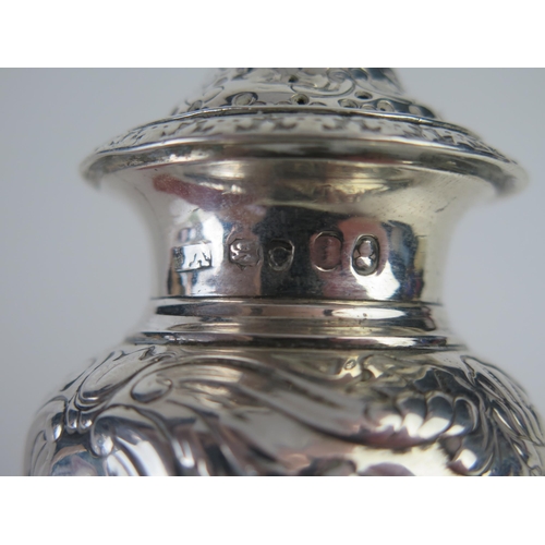 673 - A George IV silver pounce pot, maker Joseph Angell I, London, 1824, of baluster form, with embossed ... 