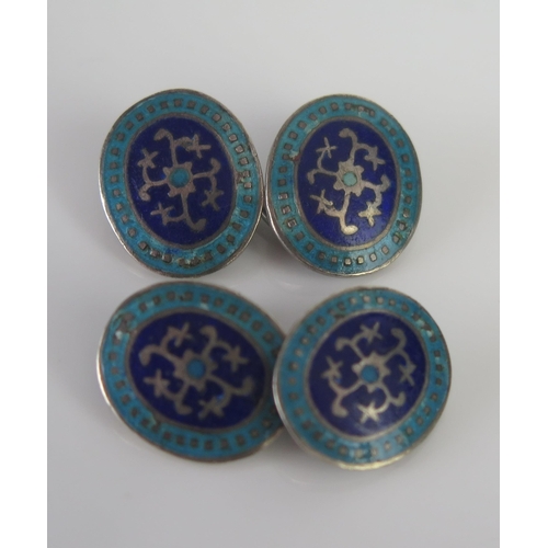 674 - A pair of silver and enamel cufflinks.