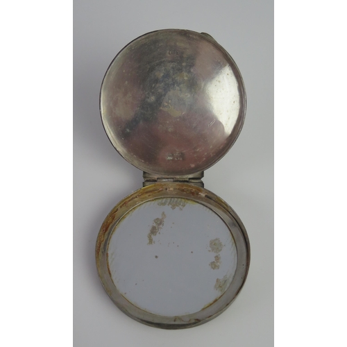 675 - A Continental silver circular compact with inset mirror panel, 7cm diameter,