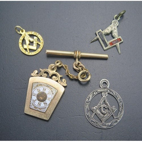 73 - A Masonic Gilt and Enamel Fob, 9ct gold Masonic pendant (.92g), silver Masonic pendant and one other