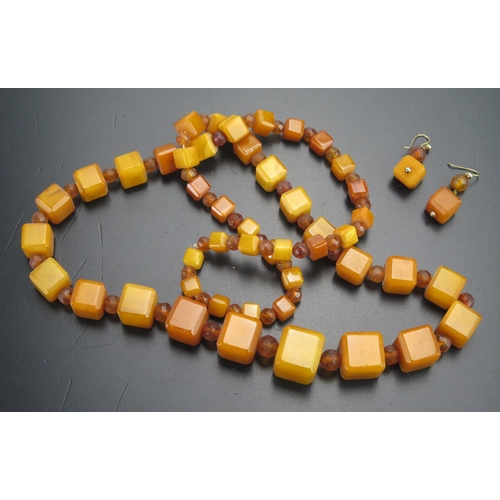 82 - A Pressed Amber Square Bead Necklace and earrings, 77.4g