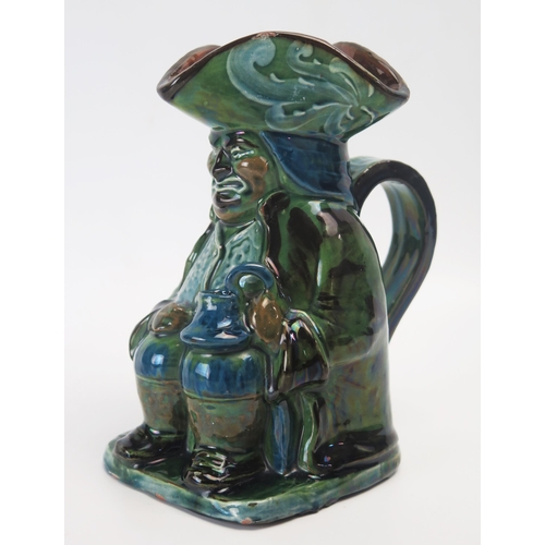 1001 - A Brannam pottery Toby jug, with variegated green and blue glaze, incised signature to the base, dat... 