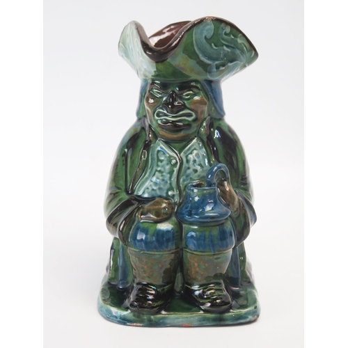 1001 - A Brannam pottery Toby jug, with variegated green and blue glaze, incised signature to the base, dat... 