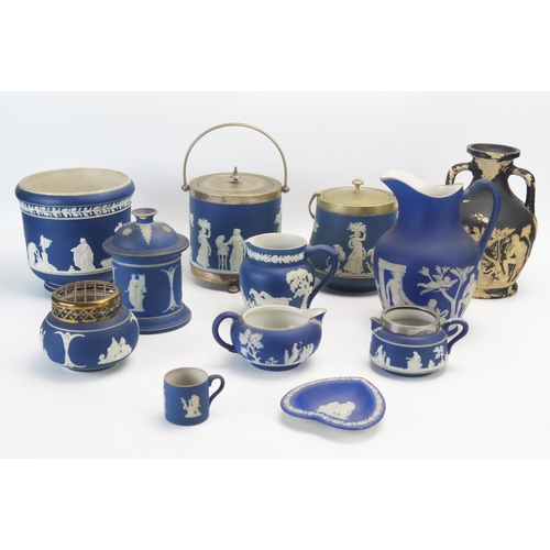 1011 - A collection of Wedgwood  and other jasper wares including biscuit barrels, jugs,  jardinière,  and ... 