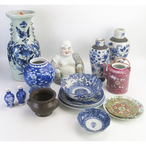 1025 - A Chinese blue and white sleeve vase, 26cm high, a figure of a seated laughing Buddha, various vases... 