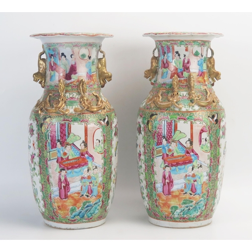 1029 - A pair of 19th century Cantonese export porcelain vases, with famille verte pallet decorated with pa... 