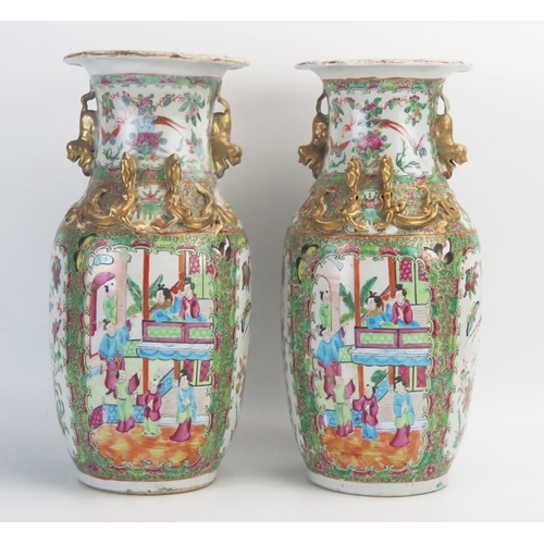 1029 - A pair of 19th century Cantonese export porcelain vases, with famille verte pallet decorated with pa... 