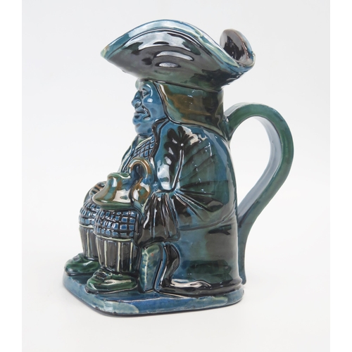 1032 - A Brannam pottery Toby jug, with variegated green and blue glaze, incised signature to the base, dat... 