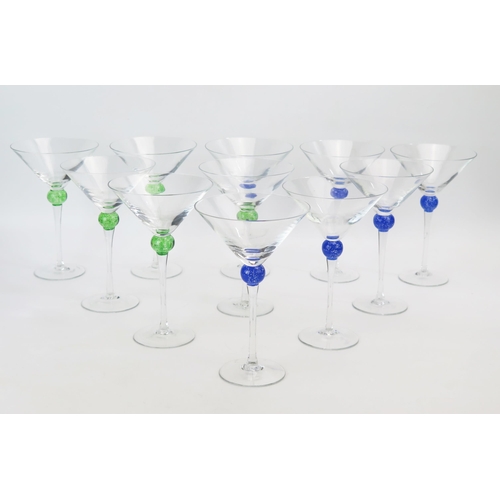 1053 - A set of six Martini glasses with blue ball knopped stems, together with a further five green ball d... 