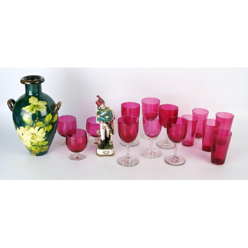 1053A - A collection of assorted Cranberry glass drinking vessels, Doulton faience vase and porcelain Hussar... 