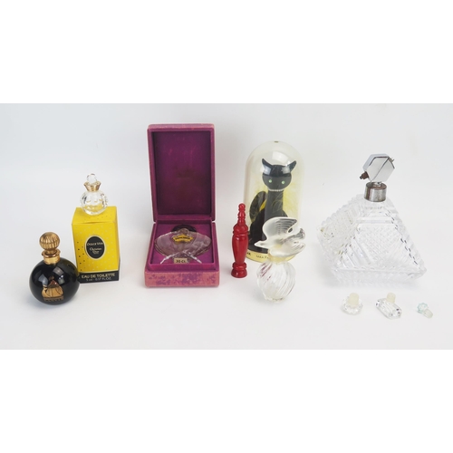 1058 - A collection of assorted glass and other scent bottles including Lalique and others.