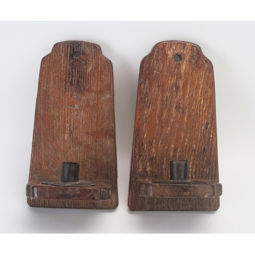 1073 - A pair of oak wall lights of arched outline, 23cm high, made from the medieval oak from Blakeney Chu... 