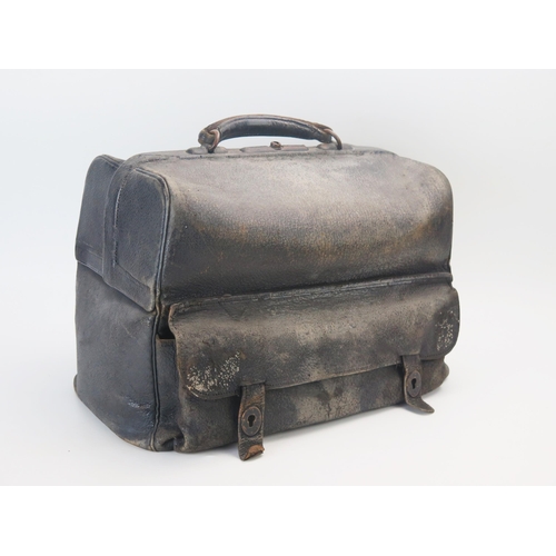 1075 - A black leather Gladstone type bag, with fitted interior. A/F