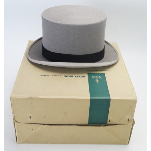 1077 - A Gents grey top hat, by Moss Bros, size 6 3/4, contained in a card box.