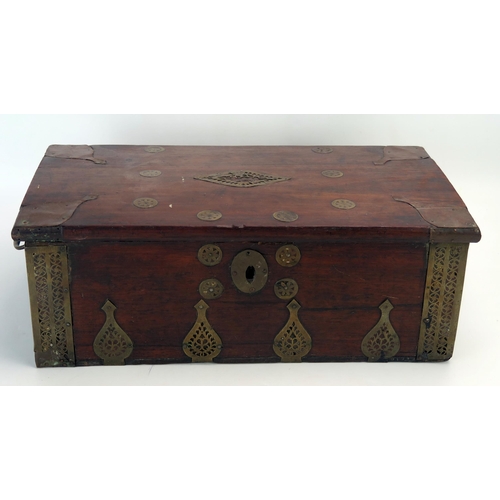 1088A - A middle eastern hardwood and brass mounted scribes box, of rectangular outline, the hinged lid encl... 