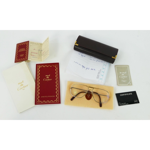 1099 - A pair of Cartier gents spectacles, contained in their case, with paperwork.