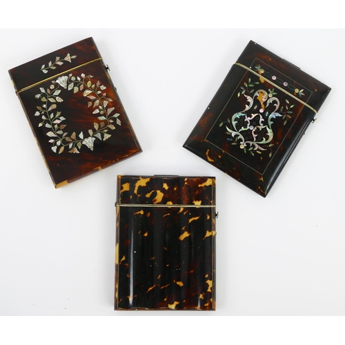 1101 - Two tortoiseshell and mother-of-pearl inlaid card cases both 10.5cm long, together with a blonde tor... 