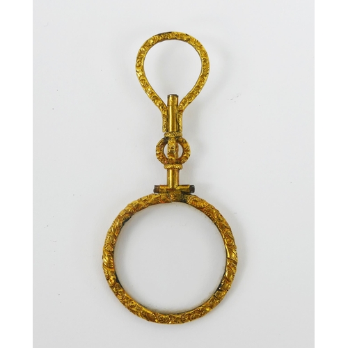 1104 - A 19th century gilt metal quizzing glass, with loop suspension ring, 7.5cm long.