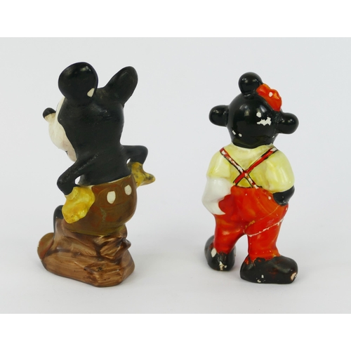 1105 - A Wade Heath figurine of Mickey Mouse, seated wearing orange shorts with hands on hips, 10cm high, (... 