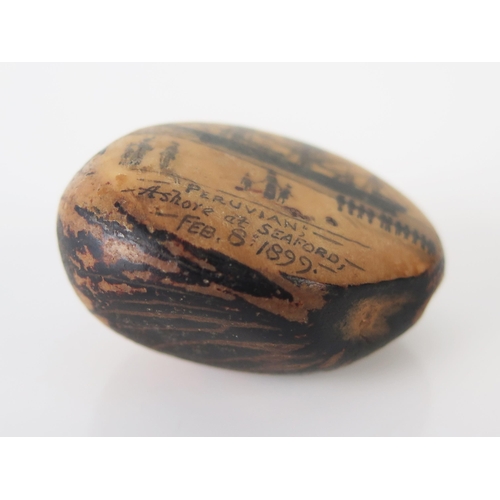 1125 - A decorated hardwood nut entitled 