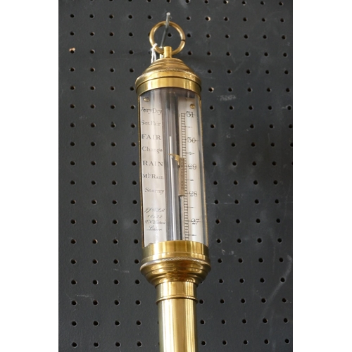 1134 - Portuguese brass marine stick barometer, the silvered register calibrated in barometric inches with ... 