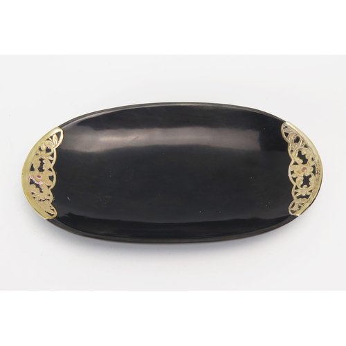 1140 - A horn and gilt metal mounted ring tray, of oval outline, 18.5cm wide.