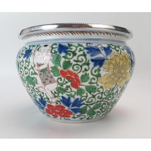 1152 - A French Chinoiserie decorated famille verte porcelain and silver mounted bowl, decorated with child... 