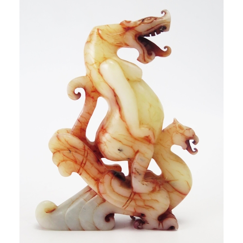 1157A - A  carved hardstone figure of a dragon and grotesque creature on its back, 14cm high.