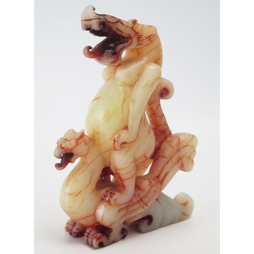 1157A - A  carved hardstone figure of a dragon and grotesque creature on its back, 14cm high.