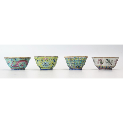 1163 - Four assorted Chinese famille rouge and other bowls, decorated with dragons, precious objects and fl... 