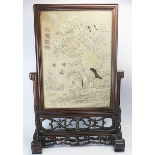 1165A - A Chinese carved hardwood table top screen, with rectangular silk work panel depicting exotic birds ... 