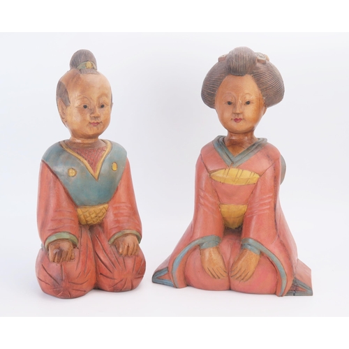 1168 - A pair of late 20th century carved wooden Chinese figures of kneeling man and woman, with polychrome... 