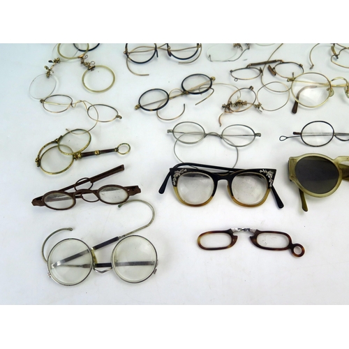 1181 - A collection of assorted 19th century and later spectacles and spectacle frames.