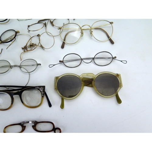 1181 - A collection of assorted 19th century and later spectacles and spectacle frames.