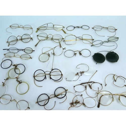 1181 - A collection of assorted 19th century and later spectacles and spectacle frames.